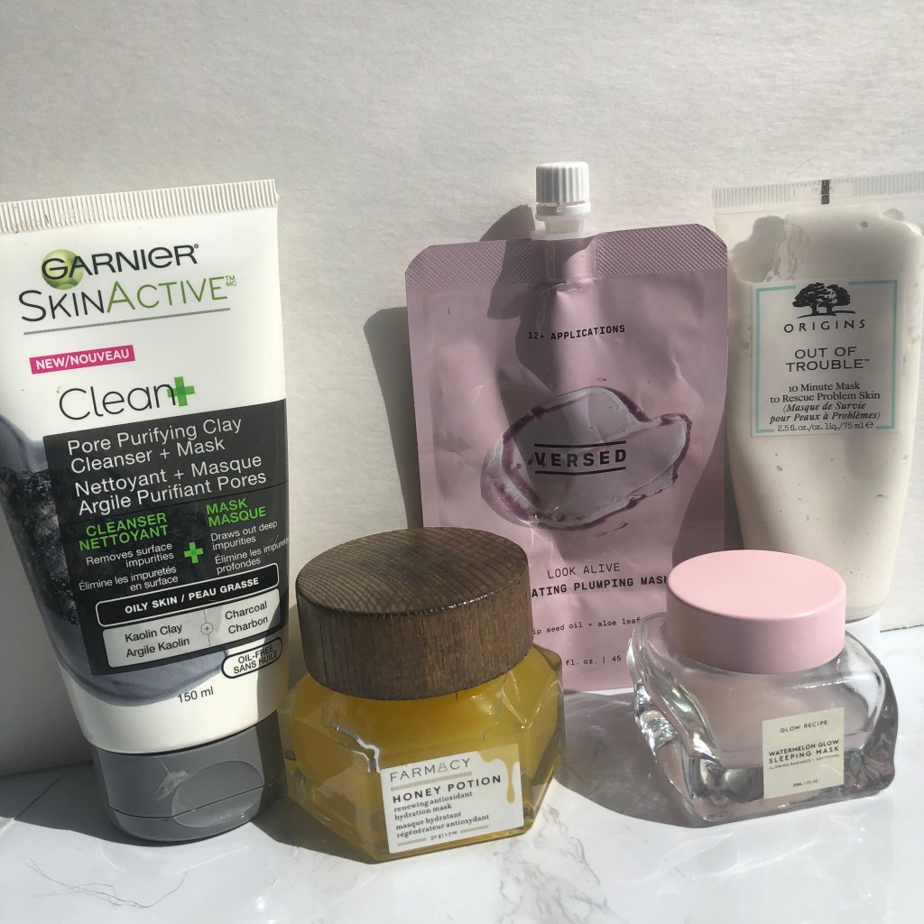 A collection of face masks from Garnier, Farmacy, Versed, Origins and Glow Recipe. Skincare for acne-prone skin. 